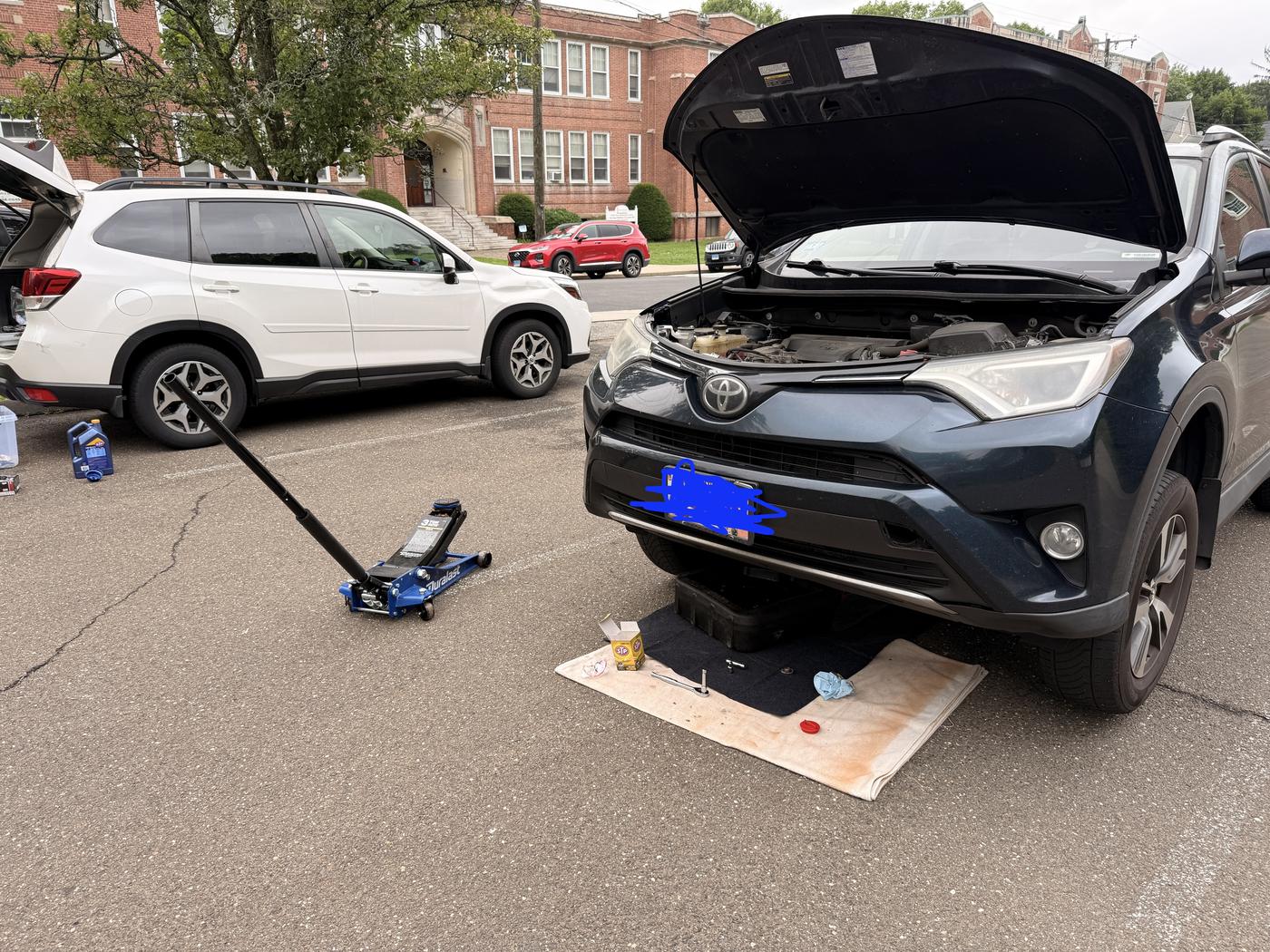 Mobile oil change on a Toyota RAV4 SUV in Connecticut